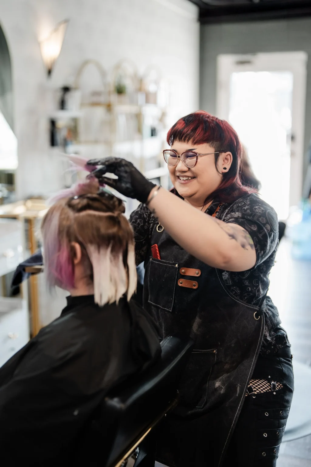 Hair stylist working with a client at The Cutting Room salon in Wheat Ridge, CO